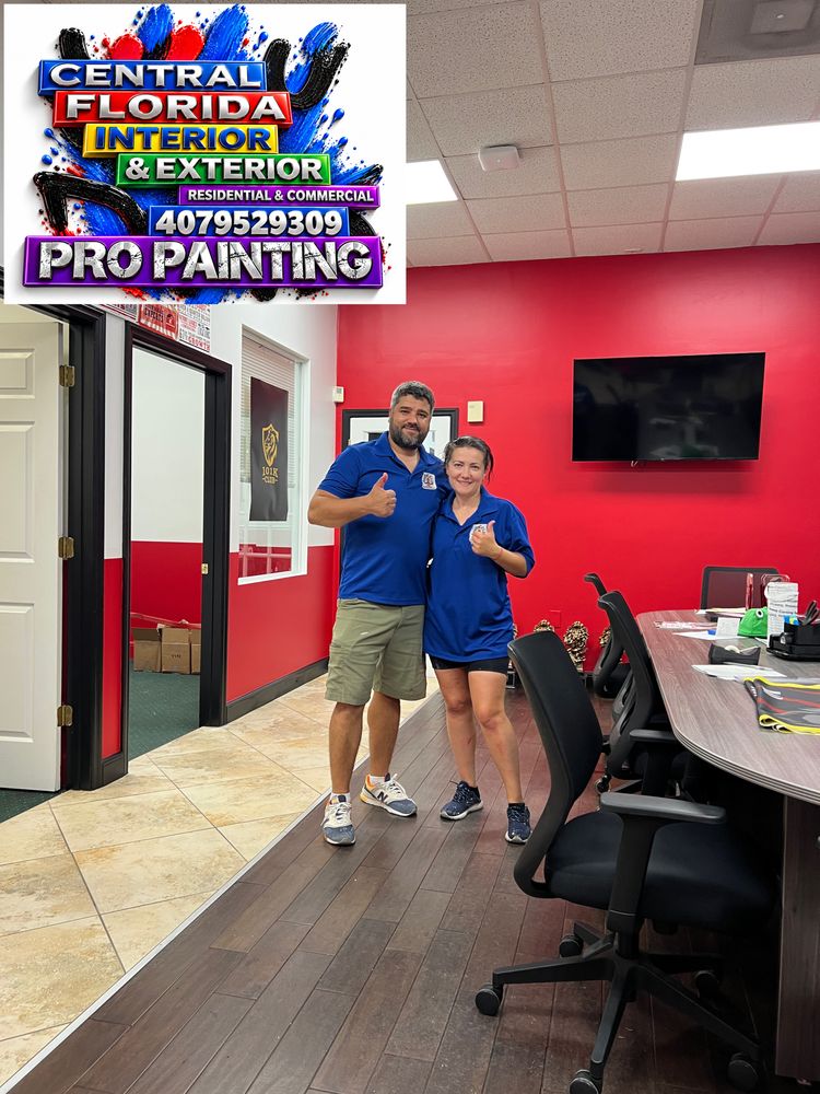 Office painted with a red accent wall